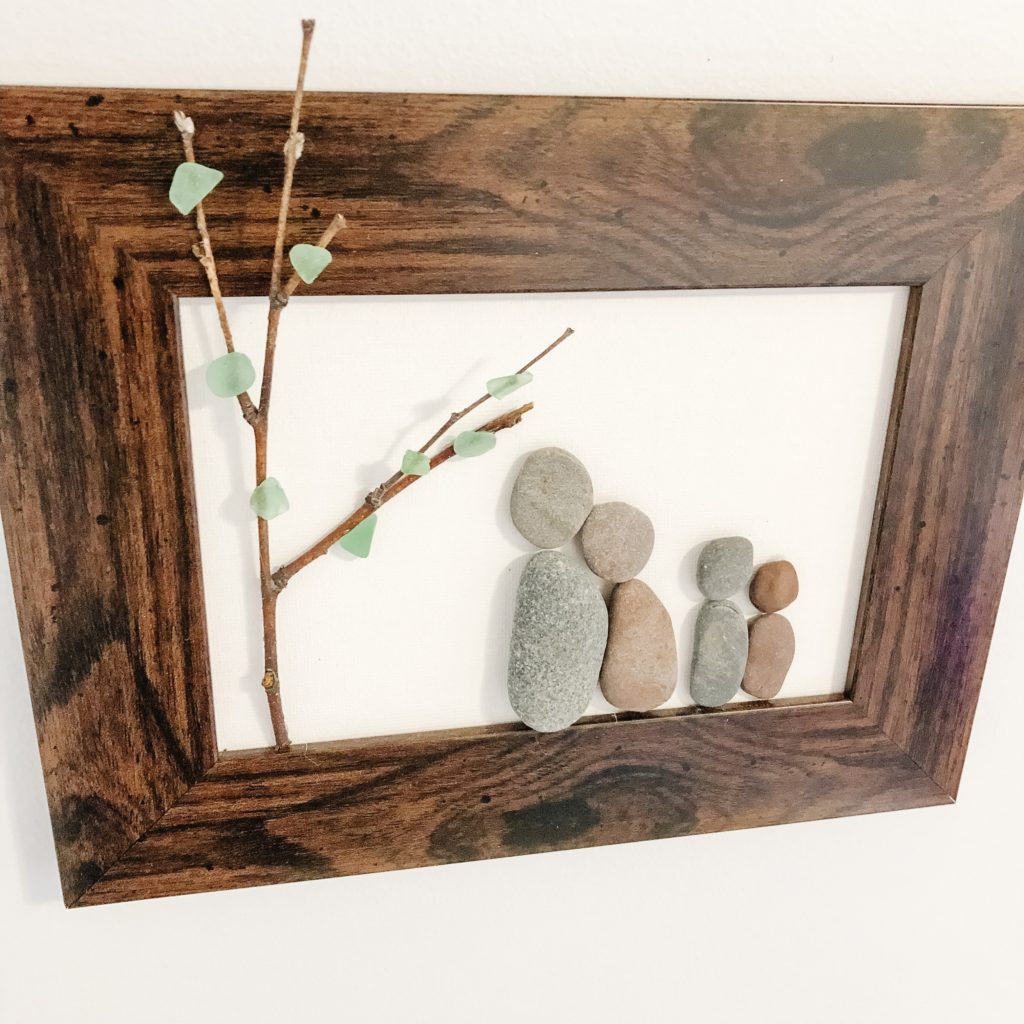 rock family art in gallery wall using pebble and sea glass